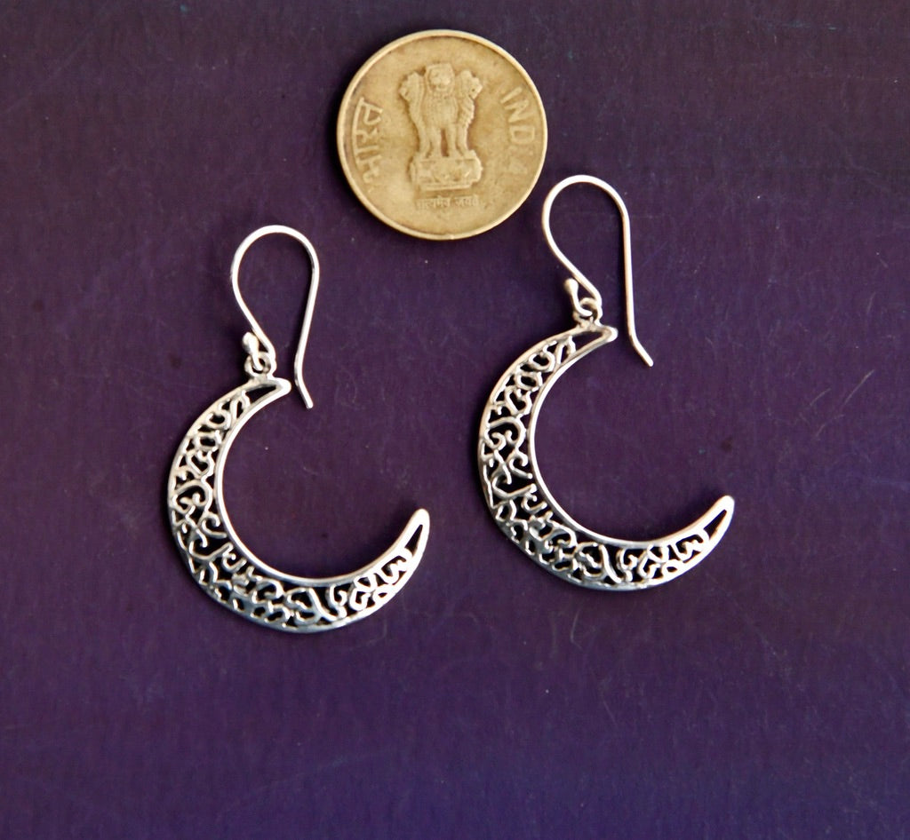 Buy Silver Flower And Half Moon Earrings With Decorative Support Chain by  RITIKA SACHDEVA at Ogaan Online Shopping Site